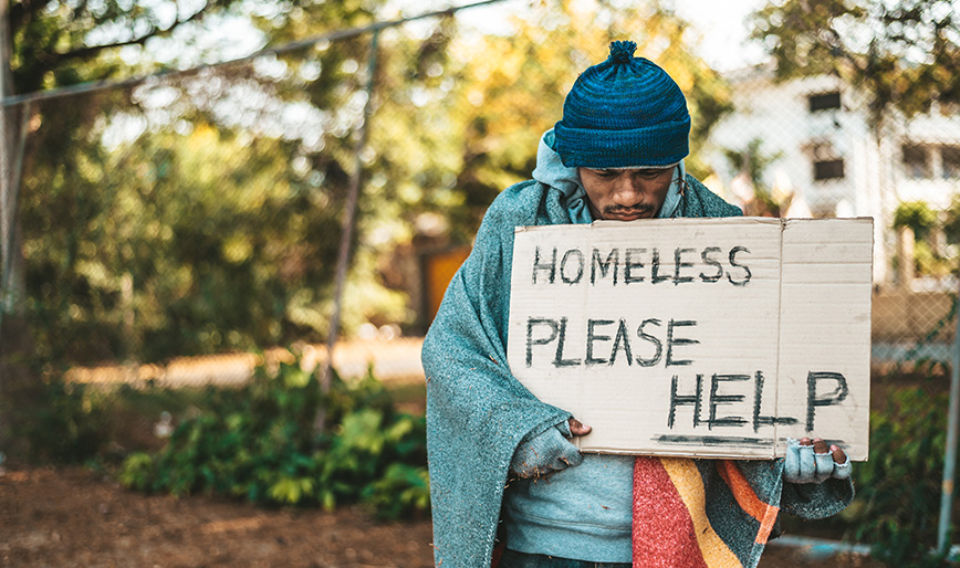 beggars-stand-on-the-street-with-homeless-messages-GDFZ73Z