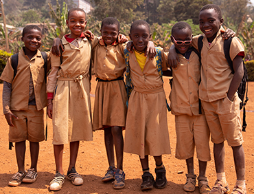 group-of-schoolchildren-standing-out-in-the-school-TMPW9KZ